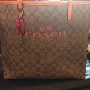 Coach orange tote with pink and orange straps